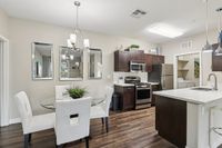 Dining Area and Kitchen with Stainless Steel Appliances