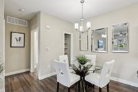 Dining Area with Wood Floors and Modern Lighting