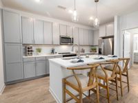 Chef's kitchen island, quartz countertops, recess lighting