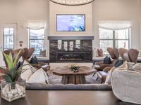 Interior clubhouse, comfortable seating around a fireplace