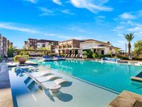 Swimming pool with lots of chaises
