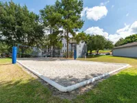 volleyball court at clermont apartment complex