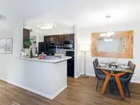Experience elegant dining and modern kitchen design, perfect for hosting and daily living.