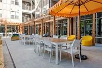 Exterior with canopy covered tales and seating at Paloma at Kent | Apartments near Kent State University