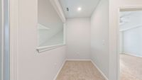 Bright loft overlooking the living room - perfect for an office or hobby corner.