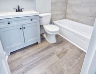 Stone top vanities, newly tiled bathrooms