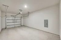 Luxe of Prosper | Apartments in McKinney | Rental in McKinney | Spacious, clean garage with smooth flooring and modern garage door, perfect for secure parking or storage.