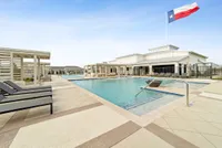 Luxurious poolside paradise with elegant loungers and chic cabanas under the Texas flag, perfect for relaxation and leisure.