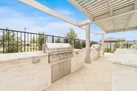 Outdoor lounge and grilling area at rental home community in Denton TX near Rayzor Ranch