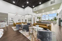 Spacious open interior living area in Denton TX single-family rental home with wood flooring