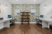 Spacious open interior living area in Denton TX single-family rental home with wood flooring