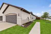 Exterior of modern single-family rental home in Denton TX with attached garage near Denton Square