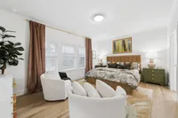 Primary bedroom in luxury rental home in Denton TX with large windows and modern finishes near Rayzor Ranch