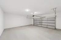 Attached two-car garage interior at single-family rental home in Denton TX near University of North Texas