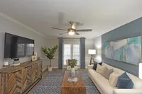 Spacious living room with hardwood-style flooring
