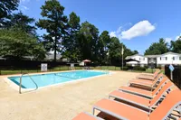 Pool area with lounge chairs