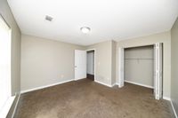 Bedroom with over and attached closet
