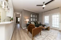 Spacious living room with hardwood-style flooring Apartments in Piedmont