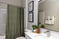 Bright bathroom with quartz counters and high-rise faucets Apartments in Piedmont