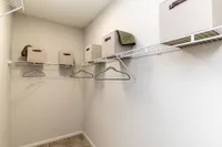 Walk-in closet with built in shelving Apartments in Piedmont