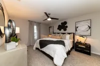 Cozy bedroom with carpet & overhead lighting Apartments in Piedmont