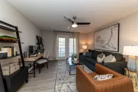 Spacious living room with hardwood-style flooring Apartments in Piedmont