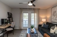 Spacious living room with overhead lighting Apartments in Piedmont