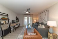 Spacious living room with hardwood-style flooring Apartments in Piedmont