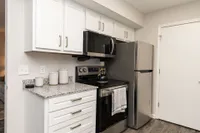 Kitchen with granite counters and stainless appliances
