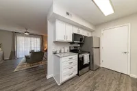 Kitchen with modern cabinetry & stainless appliances