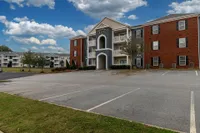 Parking spaces & building exterior Apartments in Piedmont