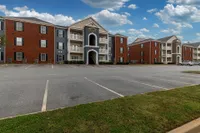 Building exterior & parking spaces Apartments in Piedmont