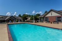 Relax and unwind at this tranquil poolside oasis, perfect for sunny afternoons.