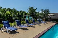 Relax by the poolside in this serene and sunny outdoor space, perfect for unwinding.