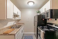 Explore this stylish kitchen, perfectly blending functionality and modern aesthetics.