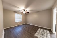 Experience comfort in this spacious bedroom, perfect for relaxation.