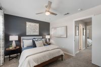 Cozy bedroom with carpet and ceiling fan