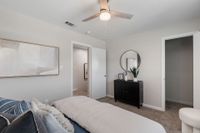 Cozy bedroom with carpet & ceiling fan