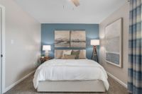 Cozy bedroom with carpet & ceiling fan