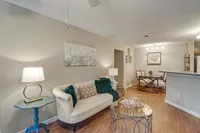 Spacious living room with hardwood-style flooring