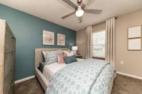 Bedroom with carpet & ceiling fan