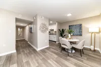 Dining area & entryway with hardwood-style flooring