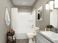 Bright bathroom with granite counters and bathtub
