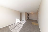 Spacious living room with carpet