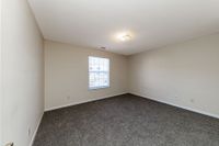 Bedroom with carpet and overhead lighting