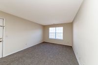Spacious living room with carpet