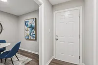 Entryway with hardwood-style flooring