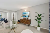 Spacious living room with carpet