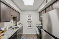 Kitchen with granite counters and modern cabinetry