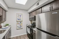Kitchen with granite counters and modern cabinetry